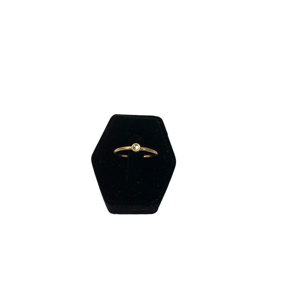 Dainty, elegant golden ring with clear stone size 6.5